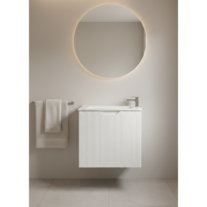 Bathroom with round mirror and white slim vanity