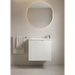 Bathroom with round mirror and white slim vanity