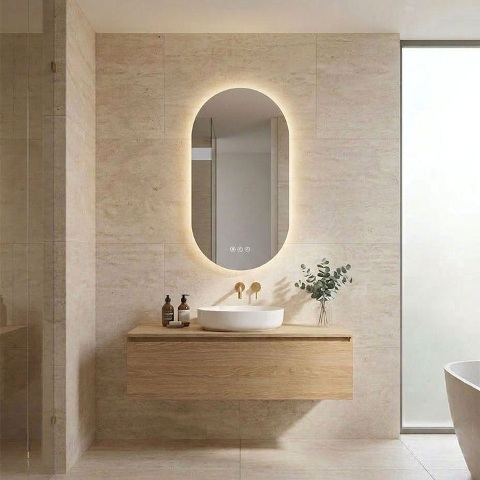 500 x 900mm Oval Pill Polished Edge Frameless LED Bathroom Mirror with three light colours, touchless motion sensor and built-in demisting function