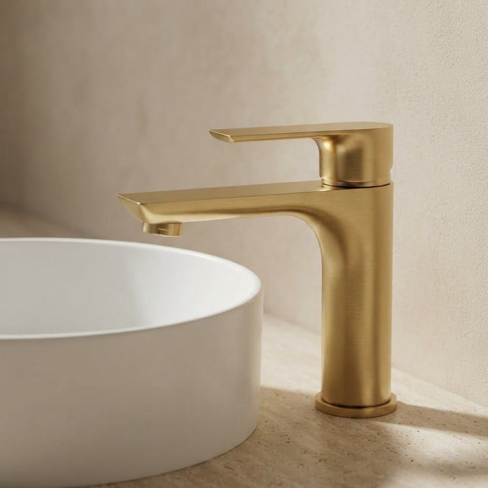 VOG Brushed Brass Short Basin Mixer with warm metallic finish and rounded lever design